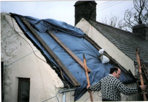 Roof covered with tarpaulin