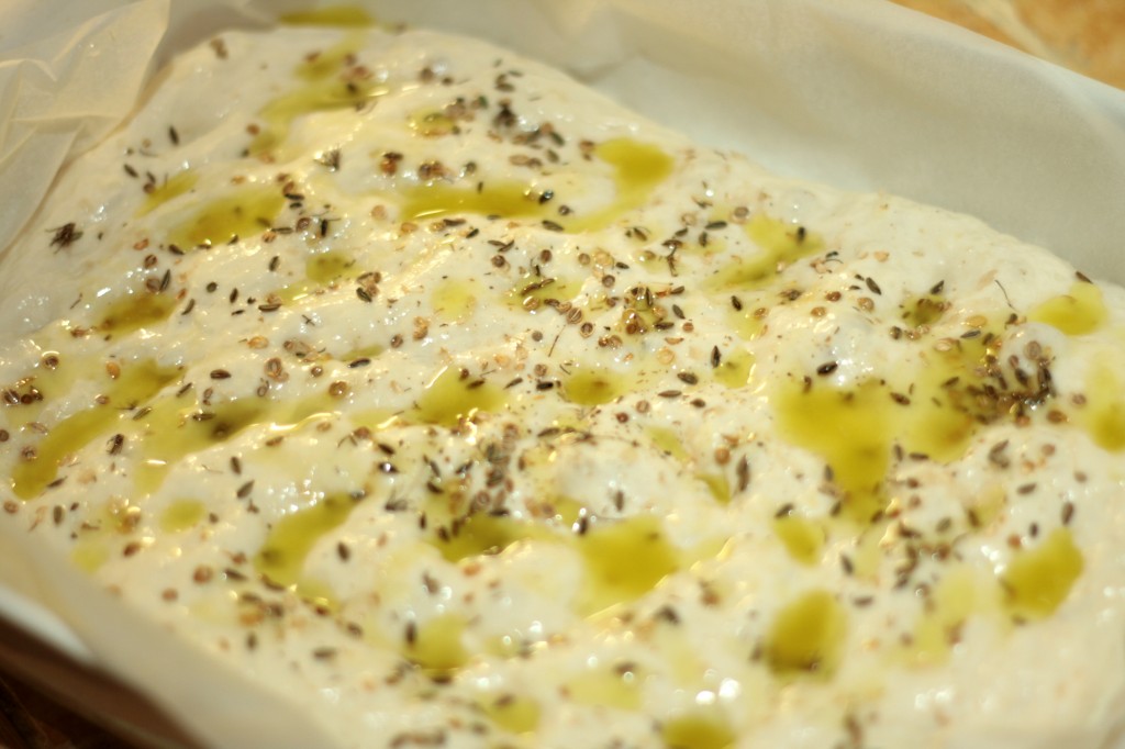 Olive oil and potato flat bread prior to baking salamoia applied