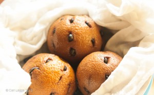 Oranges studded with coffee beans